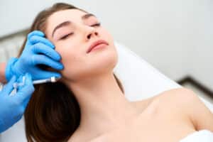 Relaxed woman getting dermal fillers in Los Angeles, CA